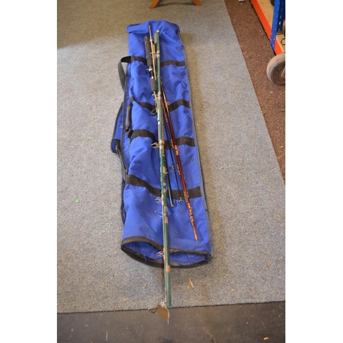 127 - 2 fishing rods & rod rest plus fishing umbrella in Shakespeare case.