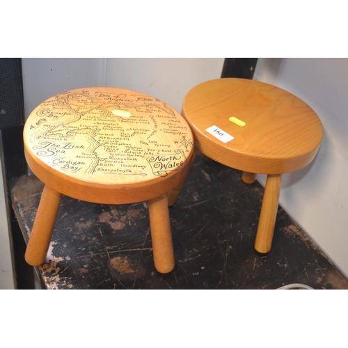 180 - Two beech milking stools, one with map of North Wales