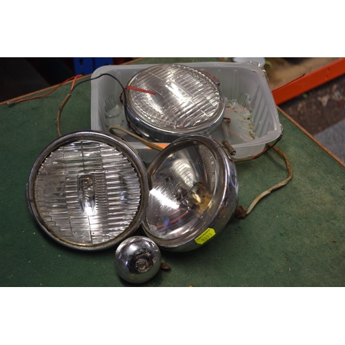 181 - Three vintage car headlights