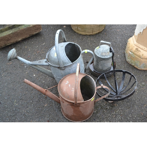 76 - 2 galvanised watering cans, 1 with rose, chicken feeder & hanging basket