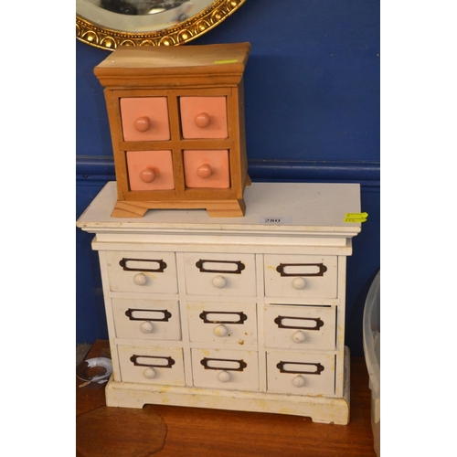 280 - Two sets of miniature drawers.