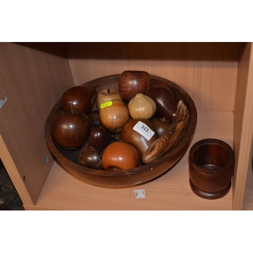 313 - Bowl full of turned wooden fruit items.