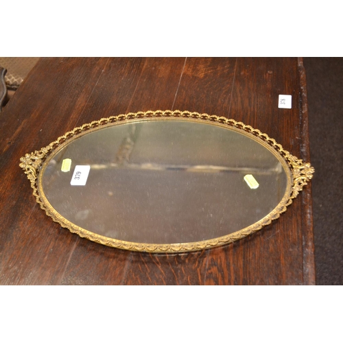 379 - Gilt framed mirrored oval dressing table tray. W42cm