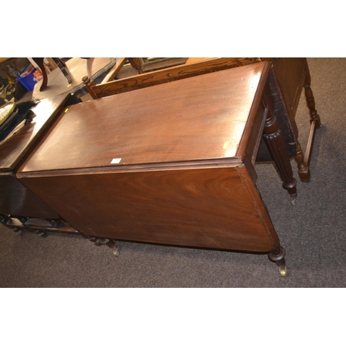 381 - Mahogany drop leaf table on casters with fluted legs, L138cm Extended W103cm.