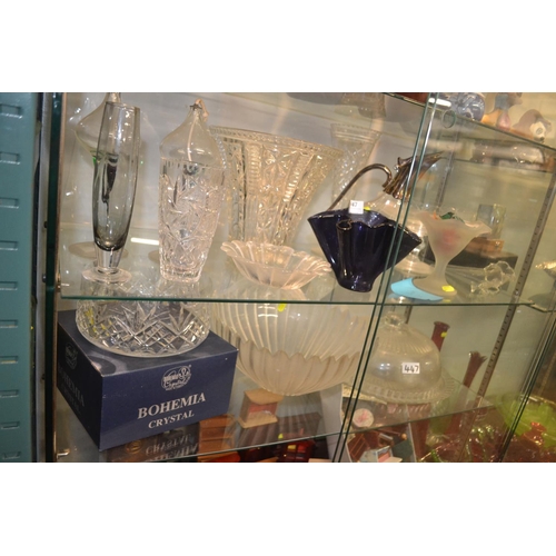 447 - Glassware and crystal over two shelfs Inc. bohemian Crystal bowl and claret jug Etc. 