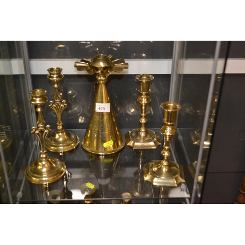 475 - Five brass candlesticks