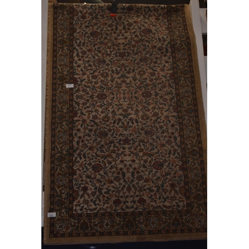 577 - Persian style rug. Machine made. W80cm L 190cm approx