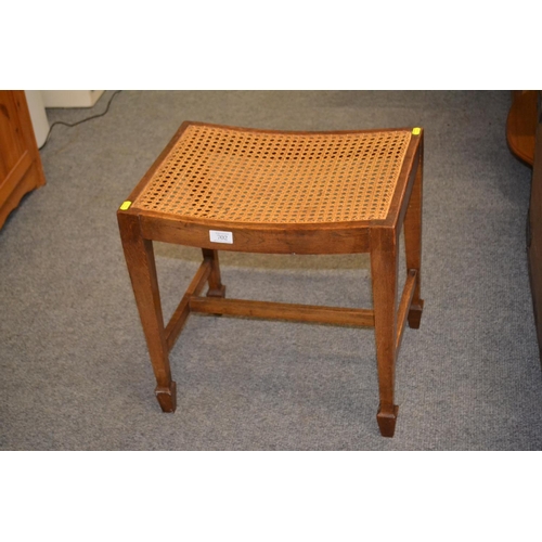 702 - Arrow footed, cane seated, oak framed dressing table stool