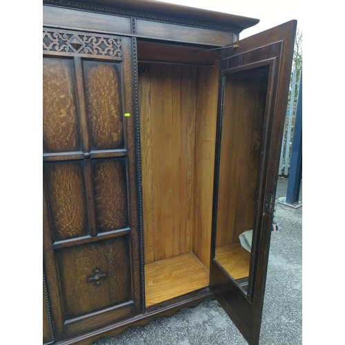 784 - Early C20 oak double wardrobe, includes key. W134cm D55cm H189cm