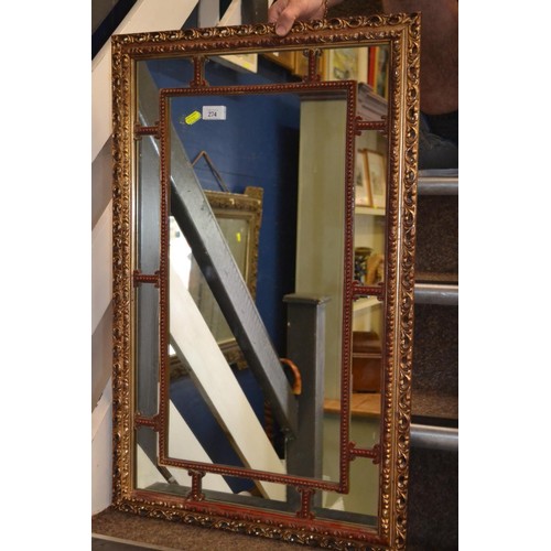 274 - Gilt framed mirror with red frame detail. 52cm x 83cm. 