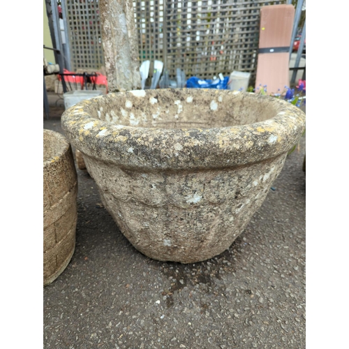 62 - 2 large garden planters. Largest H40cm d61cm