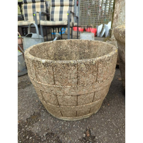 62 - 2 large garden planters. Largest H40cm d61cm