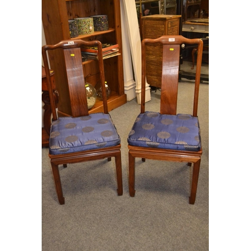 745 - Two rosewood oriental style dining chairs with seat pads