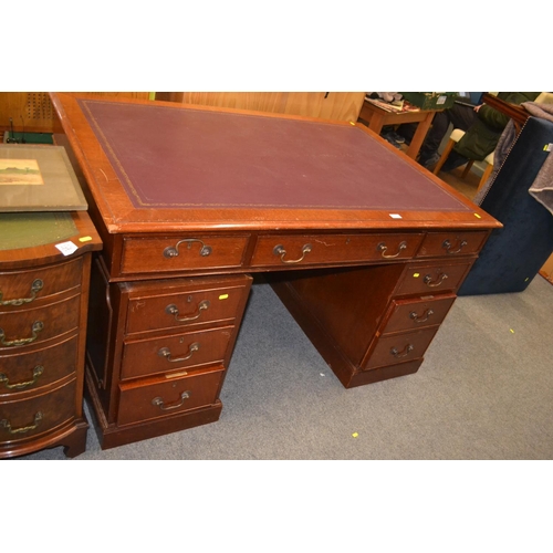 764 - Leather topped 9 drawer desk. w137cm D91cm H77cm