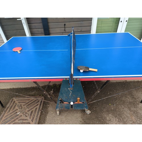 779 - Full sized Fold up Table tennis table with bats, ball and net. 