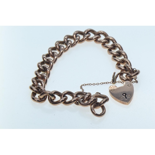 22 - 9ct gold curb link bracelet with heart-shaped padlock, 17 grams