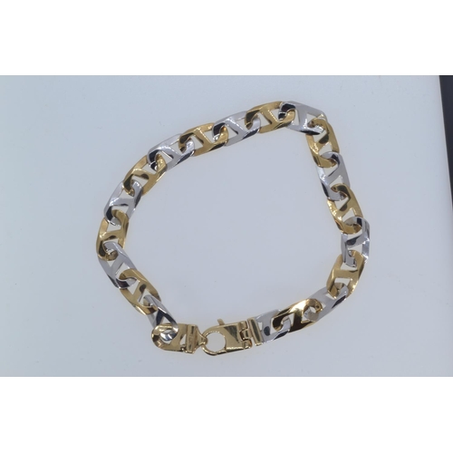 31 - 9ct bi-colour gold anchor link bracelet, circumference 220mm, 17.4 grams