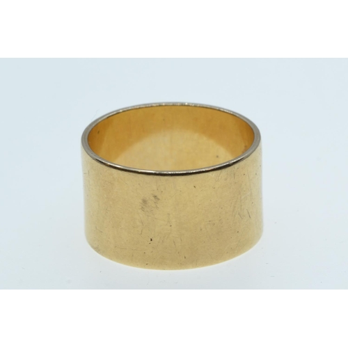 34 - Yellow metal wide band ring, tests positive for 9ct gold, size R, 7.79 grams