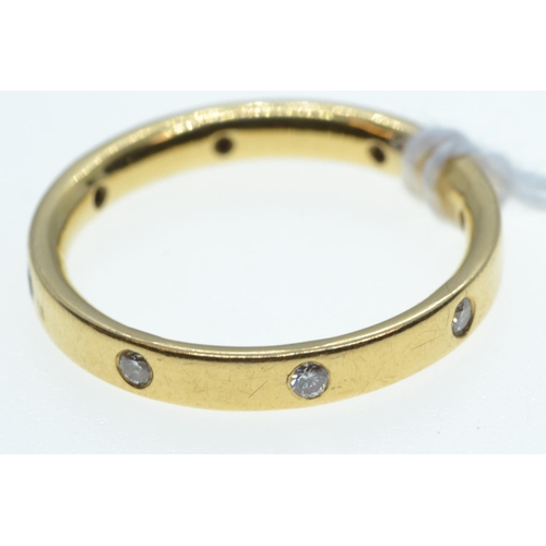 37 - Yellow metal & diamond band ring, tests positive for 22ct gold, size O, 3.8 grams