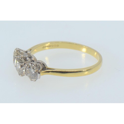 58 - 18ct gold & three stone diamond ring, the centre stone weighing approx. 0.50 carat, size R, 3.55... 