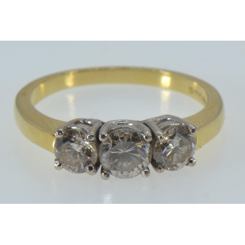 66 - 18ct gold & three stone diamond ring, the central diamond weighing approx. 0.50 carat, size R1/2... 