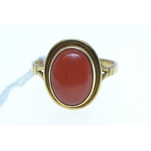 77 - Yellow metal & cabochon coral ring, tests positive for 18ct gold, size L1/2, 3.08 grams