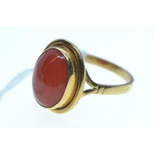 77 - Yellow metal & cabochon coral ring, tests positive for 18ct gold, size L1/2, 3.08 grams