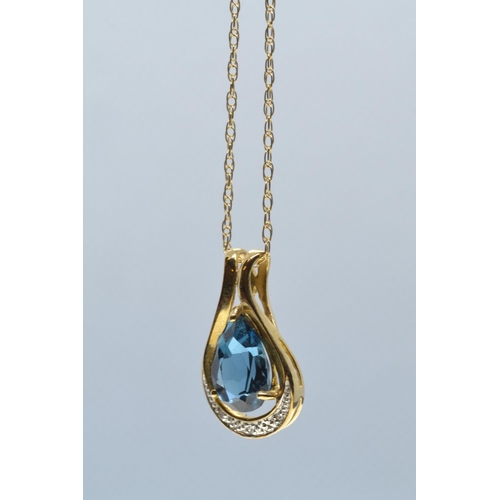 88 - 9ct gold, blue topaz & diamond pendant & chain, pendant length 19mm, chain circumference 500... 