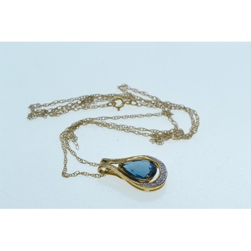 88 - 9ct gold, blue topaz & diamond pendant & chain, pendant length 19mm, chain circumference 500... 