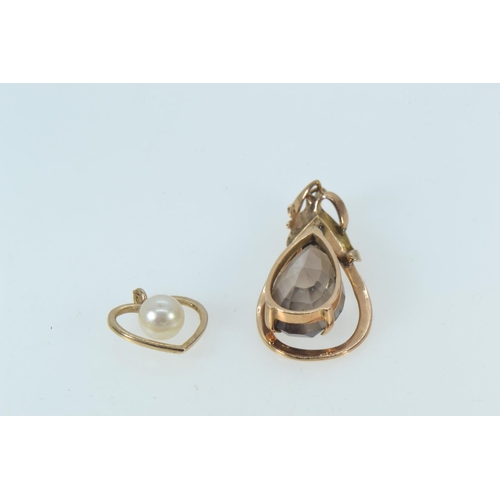 90 - Two 14ct gold pendants, one set with a smokey quartz, the other heart-shaped with a cultured pearl, ... 