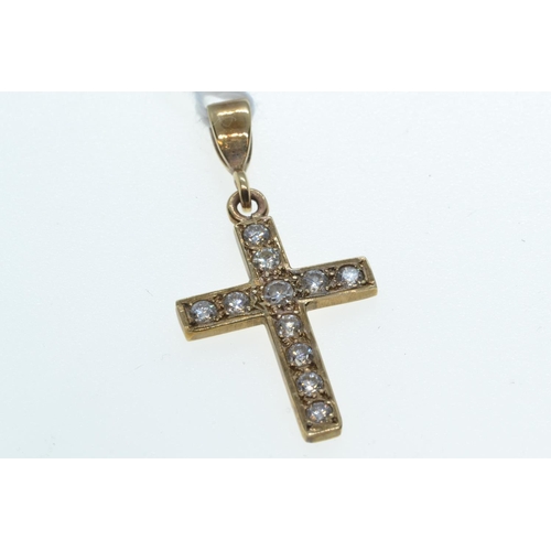 97 - Yellow metal & diamond cross pendant, tests positive for 14ct gold, length including bale 33mm, ... 