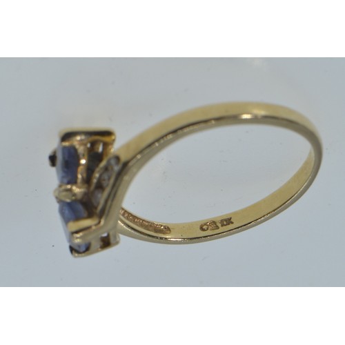 2 - 10ct gold crossover ring set with blue & clear stones, size N, 2 grams