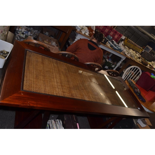 744 - Mahogany dining table with glass and rattan insert on a trestle base. 170cm wide x 80cm x 75 cm high... 