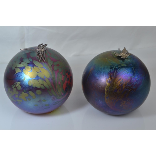 639 - Two John Ditchfield Glasform iridescent glass spherical paperweights with applied hallmarked silver ... 