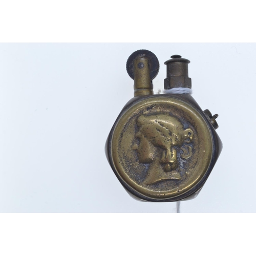 649 - WWI Queen Victoria penny brass trench lighter, approx. 35 x 50mm overall