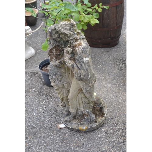 223 - Concrete garden ornament of embracing couple. H68cm. Af - damage to top.