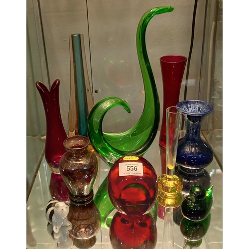 556 - Shelf of various coloured glassware including vases & a blue glazed pottery vase