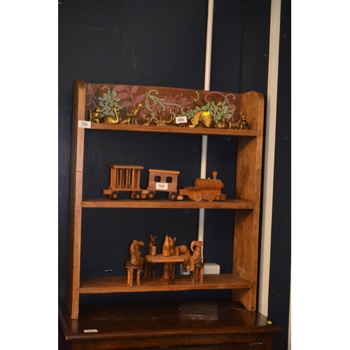 765 - Slimline oak book shelf with floral design to top shelf W63cm D17cm H76cm