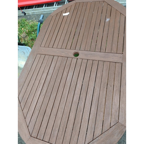 9 - Teak oval folding garden table. W90cm L150cm