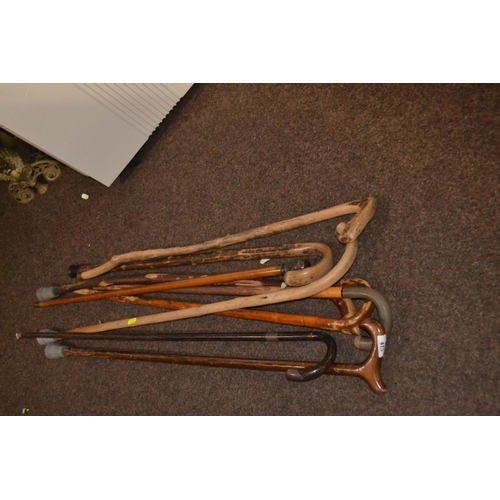 415 - 8 various walking sticks Inc silver tipped. 