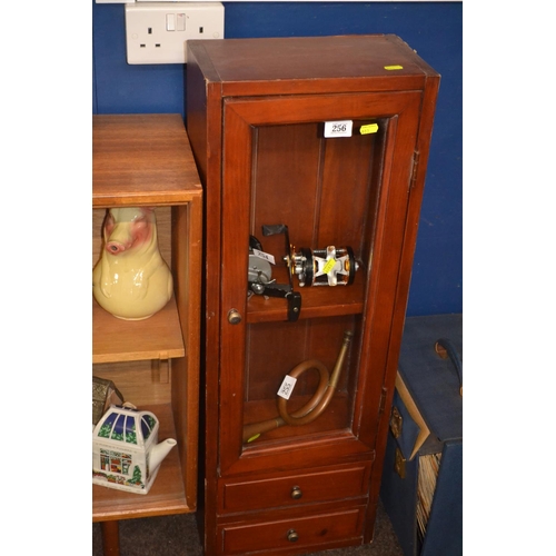 256 - Small glazed topped cabinet with 2 lower drawers. 31.5cm x 18cm deep x 90cm high.