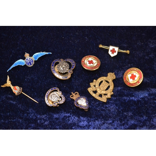 407 - Collection of enamelled badges, including silver RAF sweetheart, RAFA pin, Red Cross & British L... 