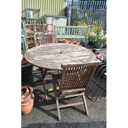 91 - Teak folding garden table & 2 folding chairs. D120cm H71cm. Table is missing 2 bolts to hold it ... 