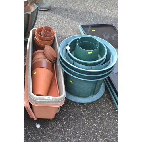 94 - Various plastic trough planters with trays, grow pots & small terracotta pots