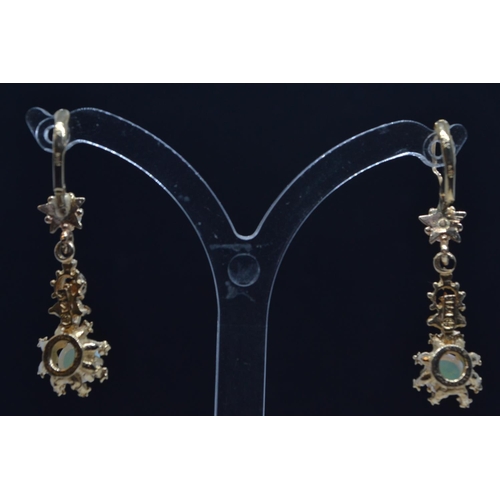 23 - Pair of 14ct gold & opal pendant earrings, with hinged hook fittings, length 35mm, gross weight ... 