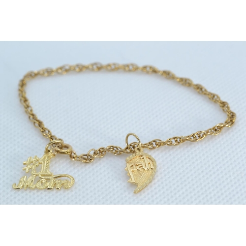 45 - 14ct gold bracelet with a 14ct gold '#1 Mom' & a yellow metal half heart charm, the yellow metal... 