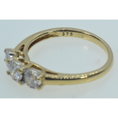 50 - 9ct gold & three stone diamond ring, tdw 0.50 carat, size O, 2.67 grams