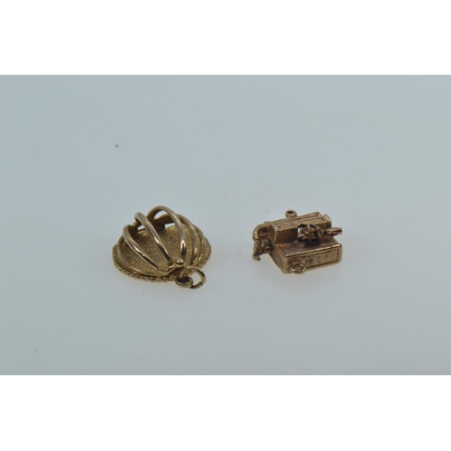 55 - Two 9ct gold charms, each marked '9.375', gross weight 8.04 grams