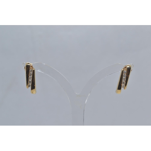 58 - Pair of 14ct gold & diamond earrings, length 16mm, post fittings, gross weight 2.05 grams