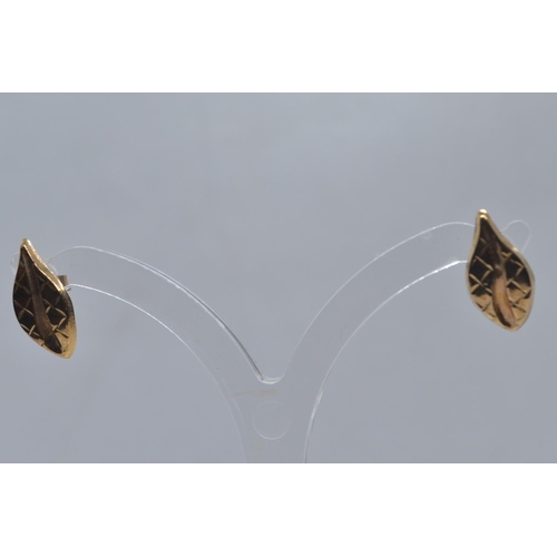 59 - Two pairs of 9ct gold ear studs, one set with amethyst, the other designed as a leaf, gross weight 2... 